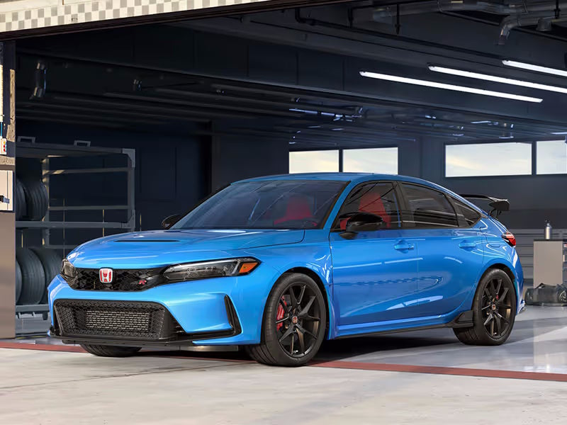 Blue car in a garage.