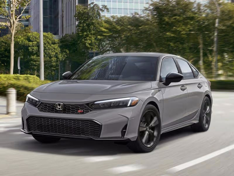 Gray Honda Civic driving on a city street.