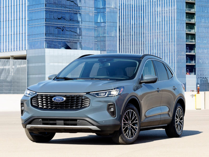 Gray Ford SUV parked in front of a building.