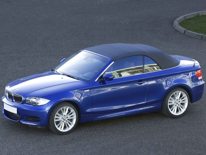 Blue convertible car on asphalt.