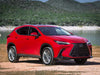 Red Lexus SUV parked near a lake.