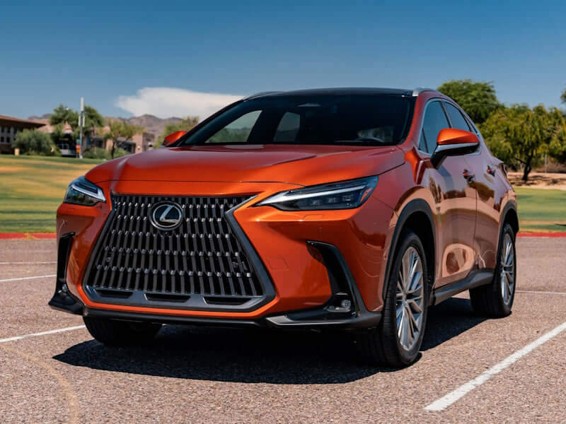 Orange Lexus SUV parked on asphalt.