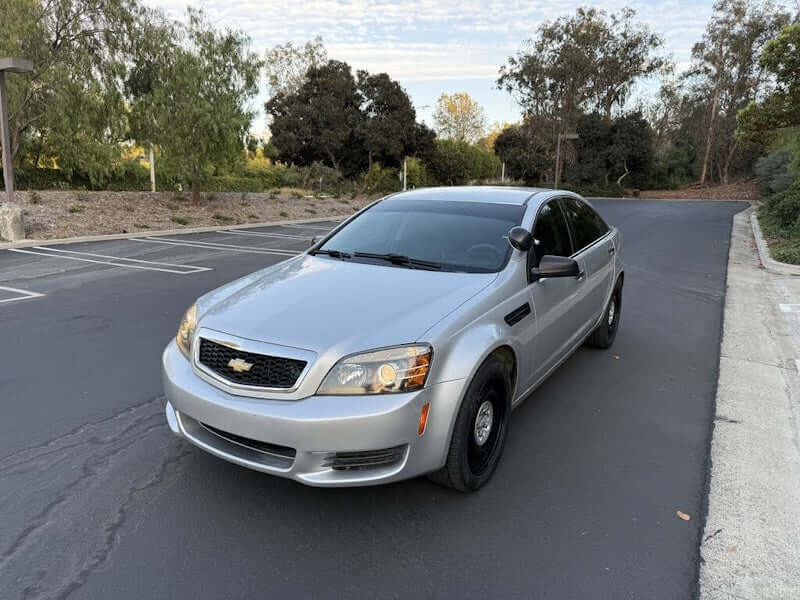 Silver sedan parked on asphalt.